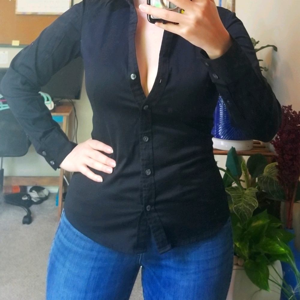 Black fitted blouse.